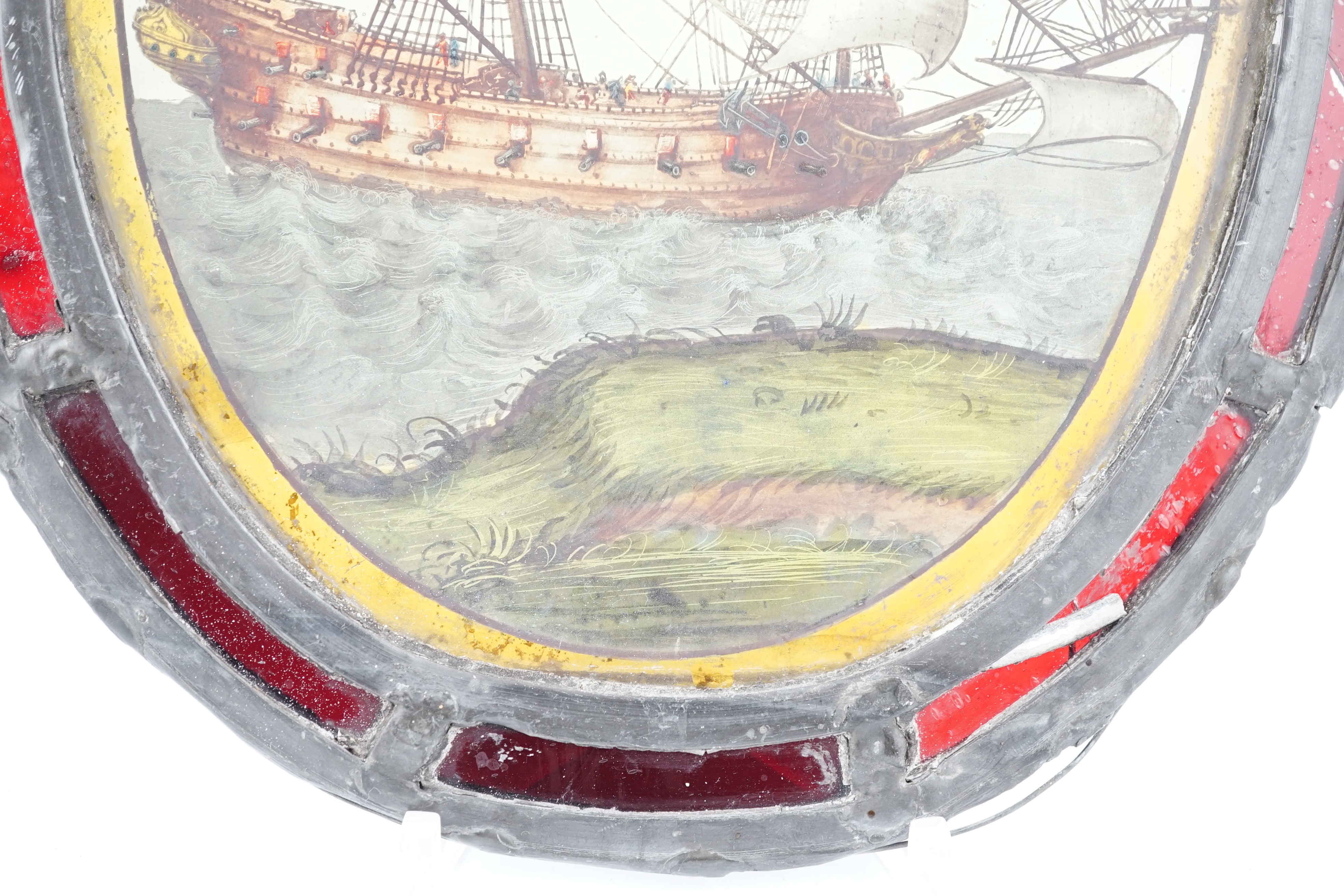 An early 18th century stained glass panel, overall 30 x 24cm